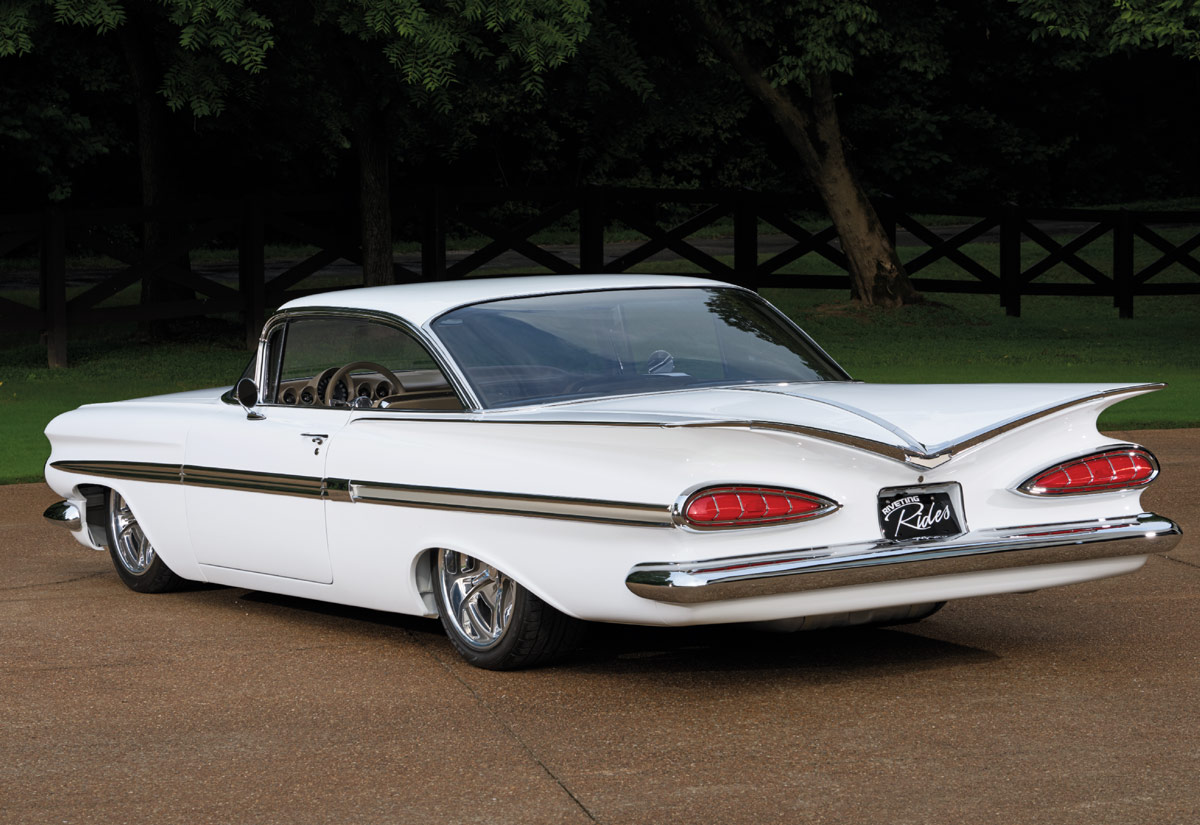 1959 Impala from rear corner showcasing full chrome bumper and sculpted trunk lid