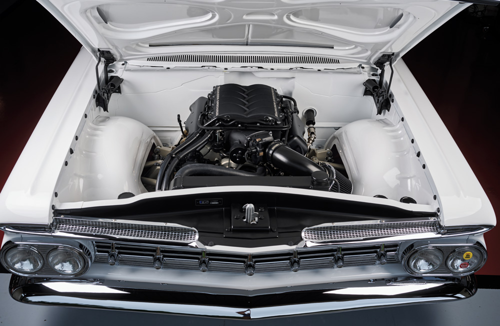 Full bay view of 1959 Impala featuring a supercharged LS engine in a smoothed white engine bay