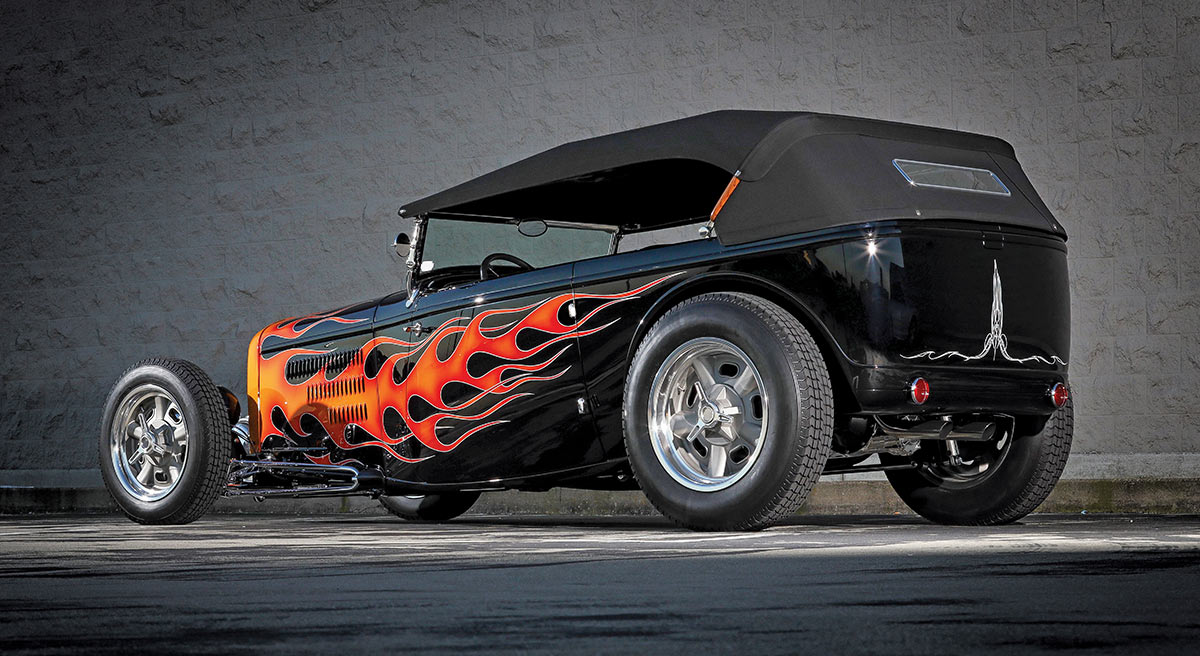 1932 Ford Highboy Roadster with black soft top and flamed bodywork in traditional hot rod style