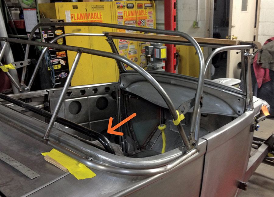 Rear framework view of roadster top in progress, highlighting reinforcement and tube bracing