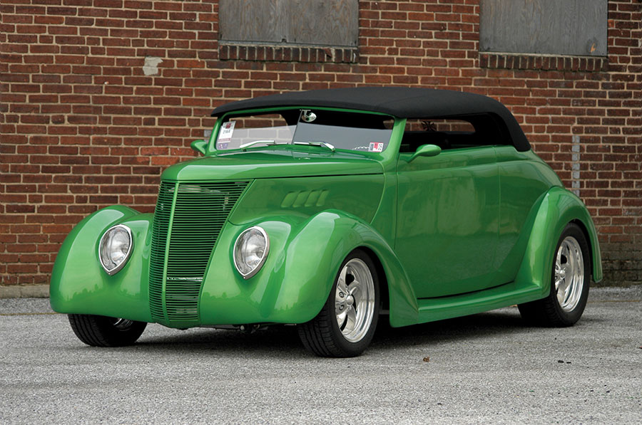 1937 Ford Roadster with modernized black soft top, billet wheels, and smoothed body panels in vibrant green
