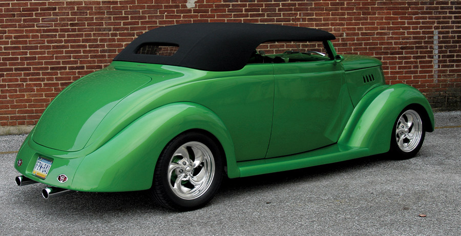 1937 Ford Roadster with black cloth top, frenched rear pan, and billet five-spokes in candy green