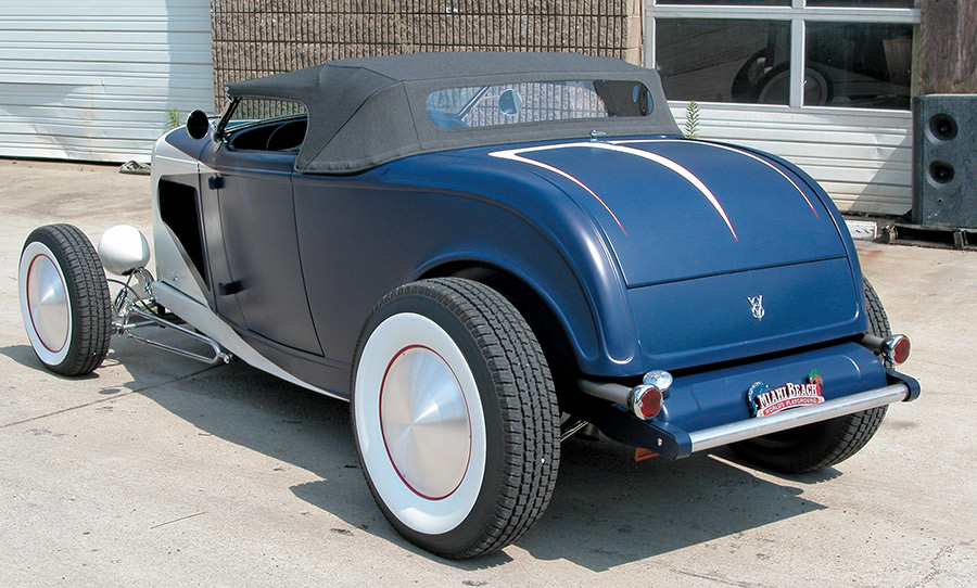 Rear shot of the same 1932 Roadster, highlighting pinstriped decklid and whitewall wheel covers