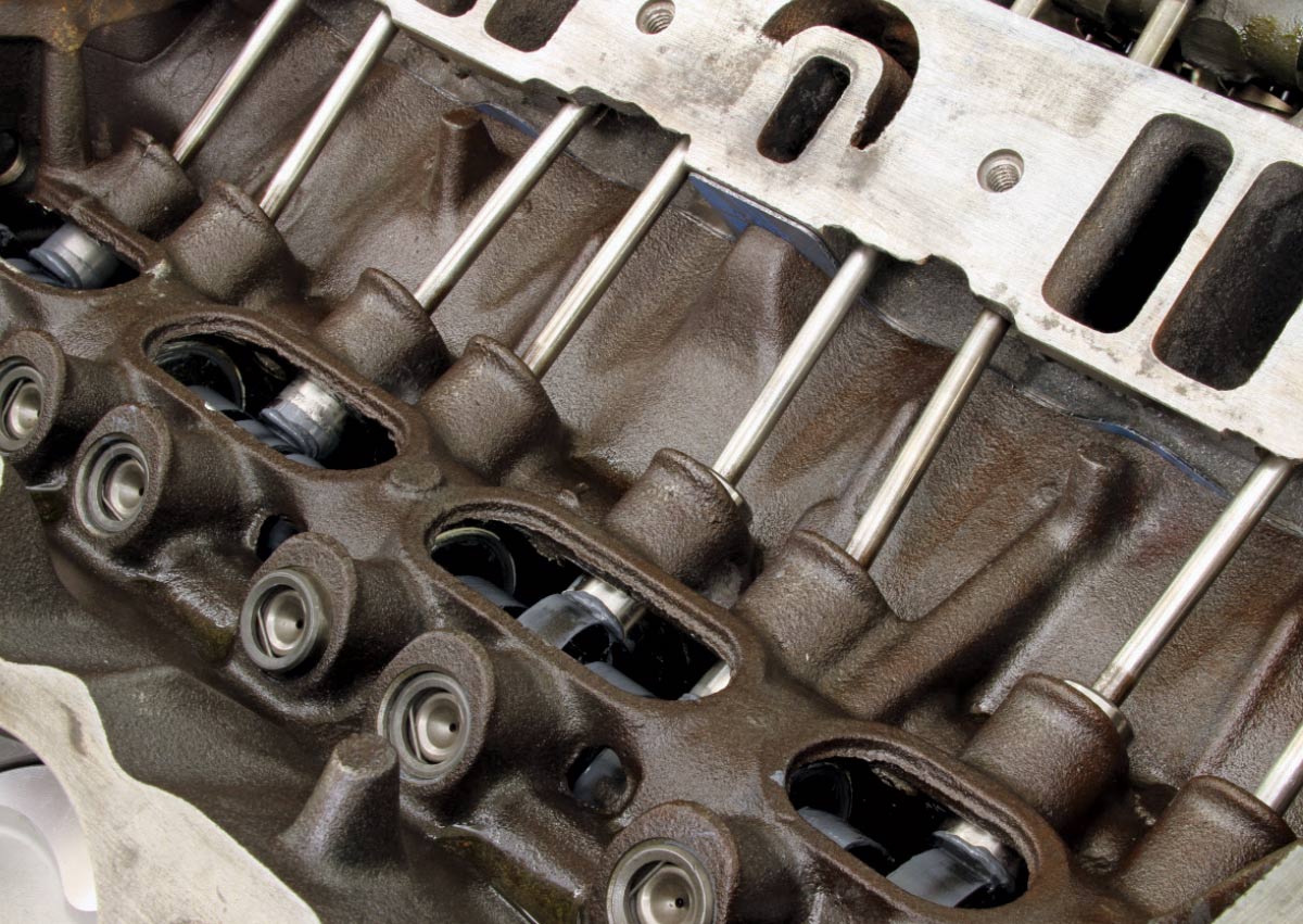 Pushrods and lifters installed in Mopar 340 valley, visible through intake opening