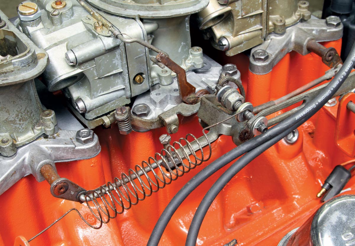 Fully assembled Mopar 340 Six Pack induction setup with vacuum pods and fuel lines