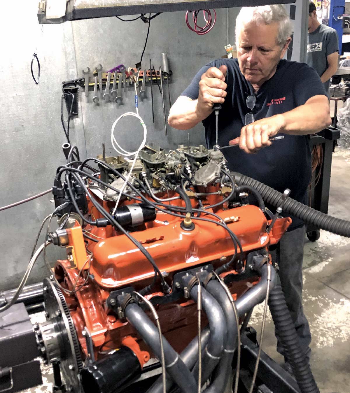 Mopar 340 Six Pack engine on dyno with headers and spark plug wires routed cleanly