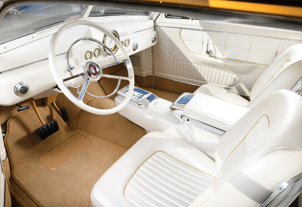 1951 Mercury Custom interior with white leather bucket seats and full-length console