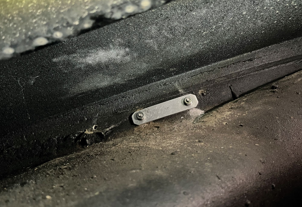 Installed mounting bracket inside classic truck’s firewall for securing fan controller hardware