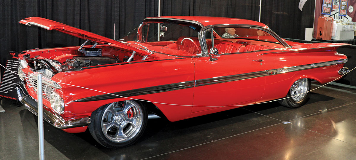 red 1959 Chevy Impala with the hood open