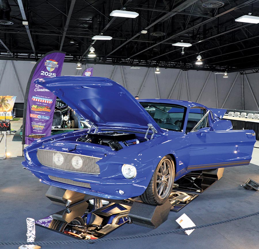 blue 1967 fastback Mustang with all doors open