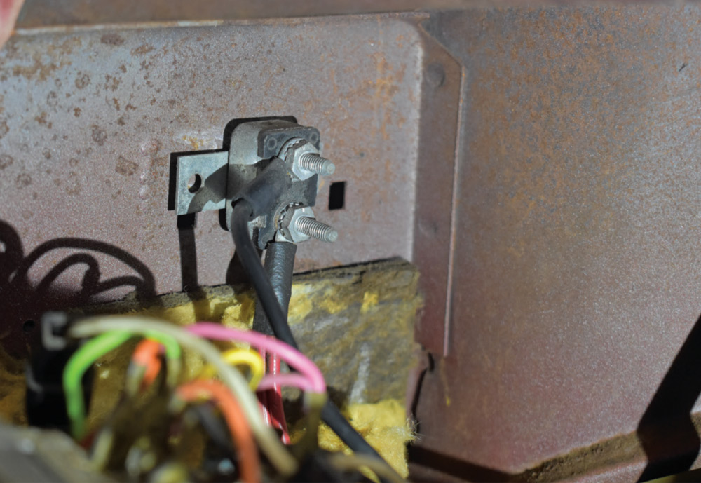 Firewall-mounted stud junction block, typical for routing high-amp feeds in 1960 Dodge rewiring setups