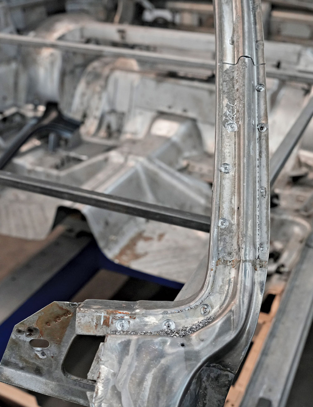 detailed shot of plug welds along newly installed pillar seam