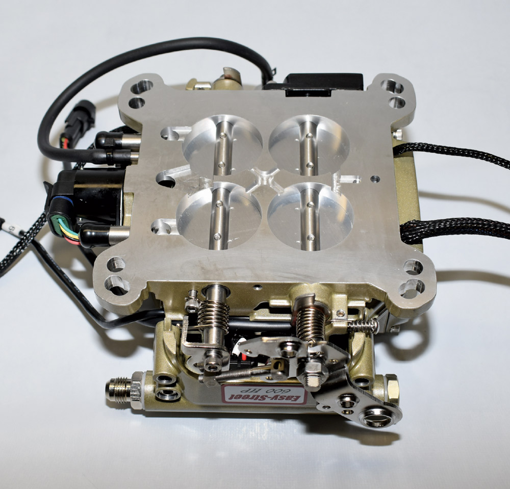 Top view of FiTech Go EFI throttle body showing four-bore layout and integrated wiring