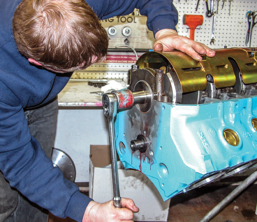 Bolting windage tray in place as part of Pontiac 428 bottom-end prep