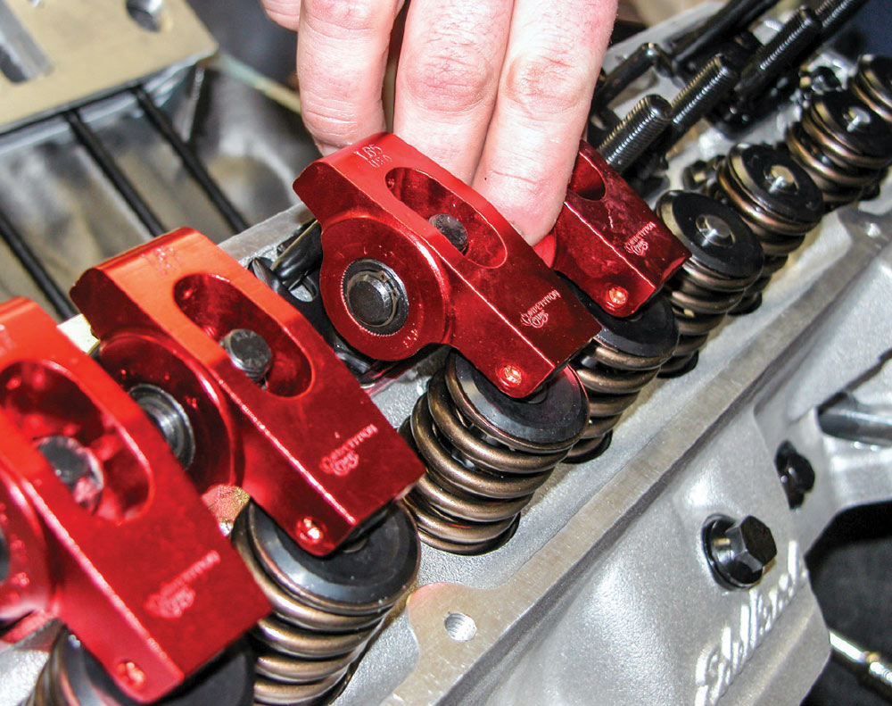 Mechanic installs a set of Comp Cams roller rocker arms