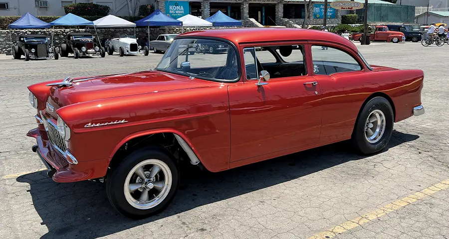 1955 Chevy 210 two-door post in red with Torque Thrust wheels