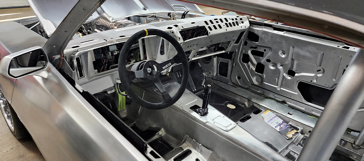 1969 Camaro bare interior view Sparco wheel and aluminum trans tunnel