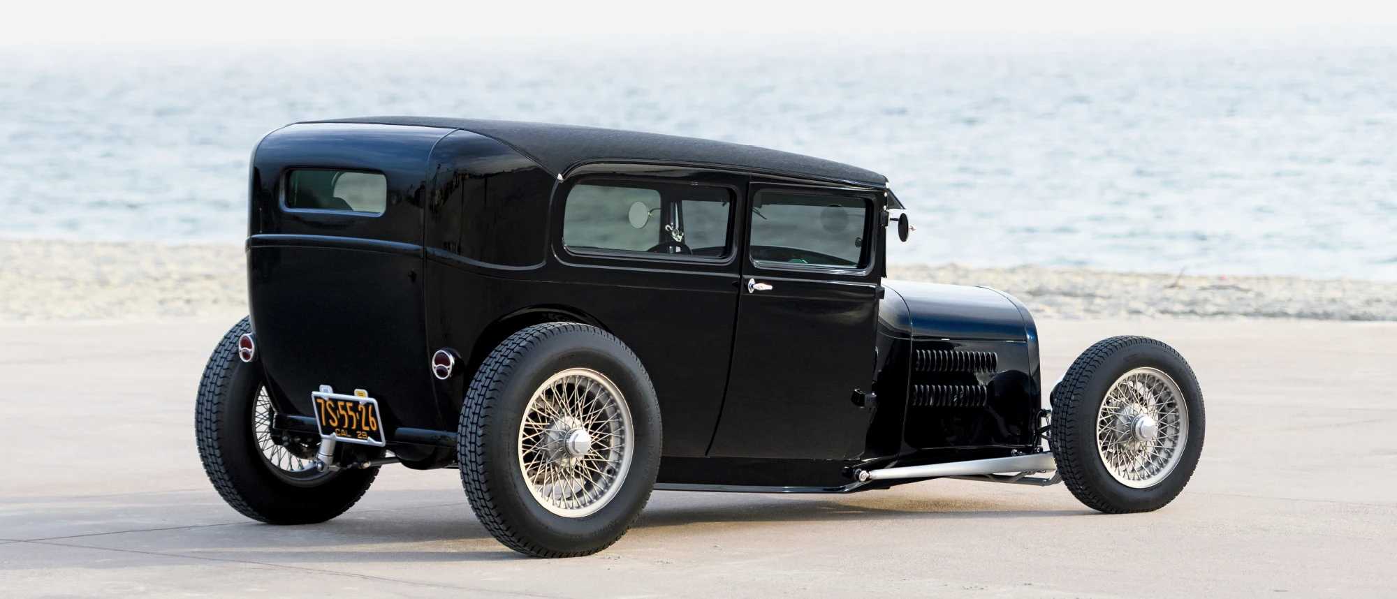 1929 Ford Tudor rear three-quarter view with smooth tail panel and California black plates