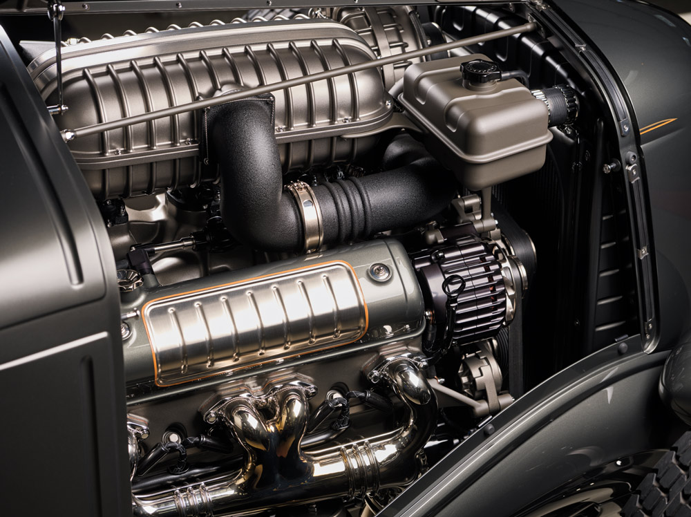 1936 Ford highboy engine bay with polished headers, detailed supercharger, and satin valve covers