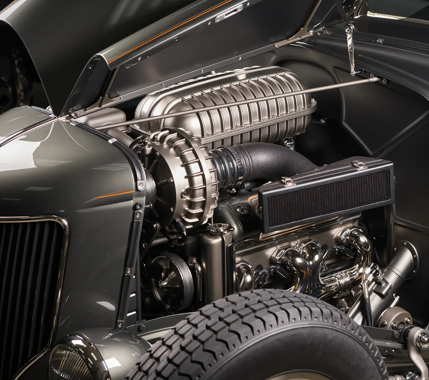 1936 Ford highboy blown V8 with vintage-style intake, twin-carb setup, and show-quality detailing