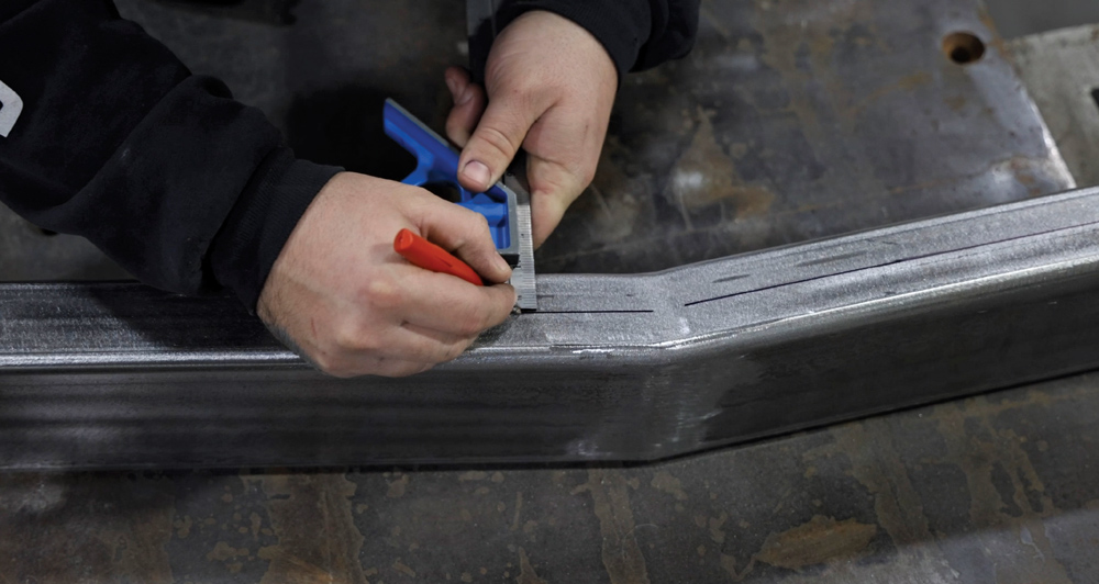 1962 Chevy convertible chassis frame rail marked for crossmember fabrication