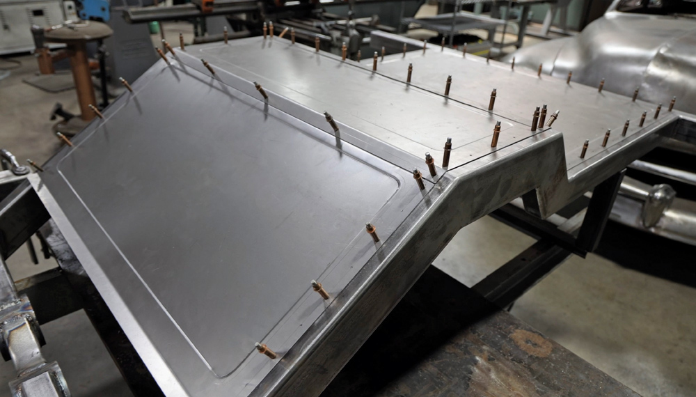 1962 Chevy convertible rear floor pan panel Cleco-clamped and contoured