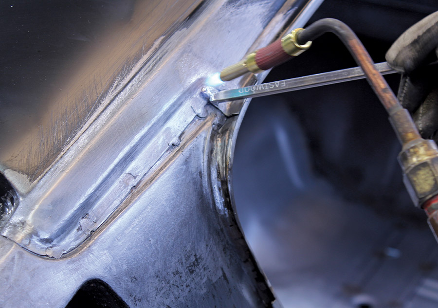 Wooden lead paddles used for shaping solder on 1965 Mustang Fastback roof seam