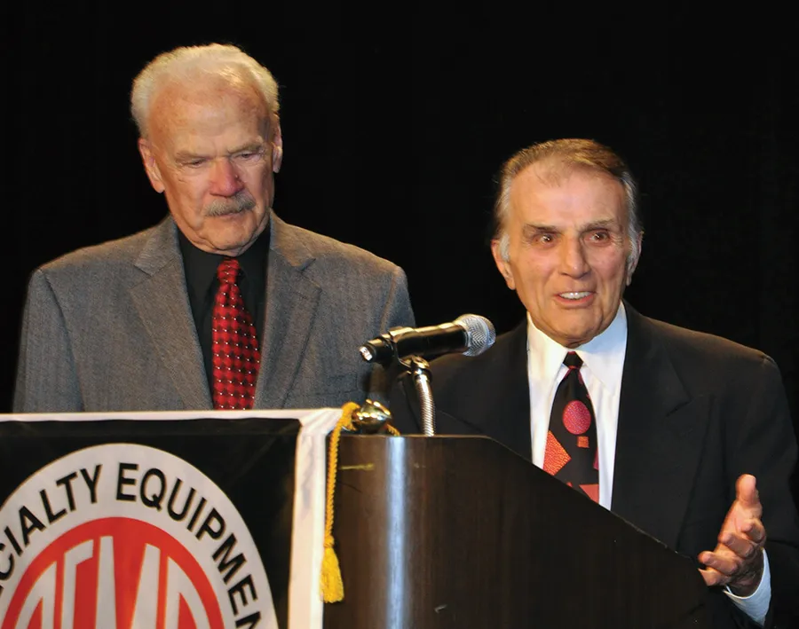 Dave McClelland and Angelo on stage at a SEMA event