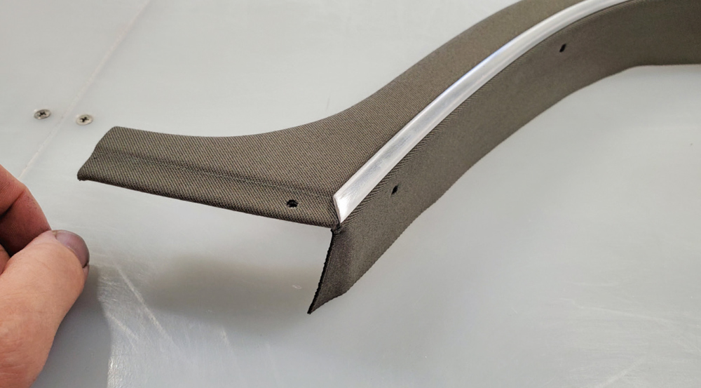 1936 Ford Roadster header bow wrapped in canvas with polished trim edge for finished convertible top