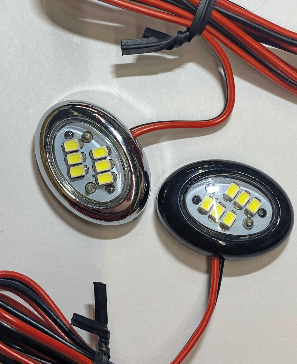 Oval LED courtesy lights, black and chrome housings, yellow LEDs, redblack wires