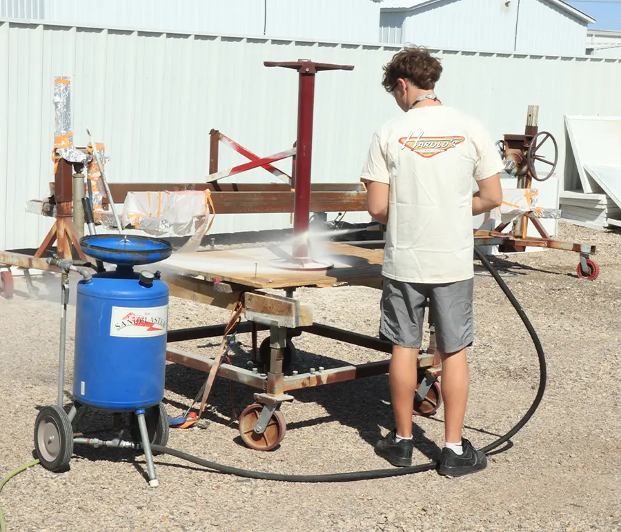 Sandblasting metal stand using The Sandblaster pressure unit