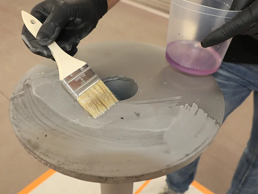 Applying POR-15 metal prep solution to sanded metal surface
