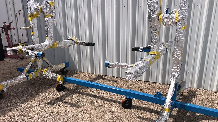 Engine stands fully wrapped in aluminum foil for masking before POR-15 coating