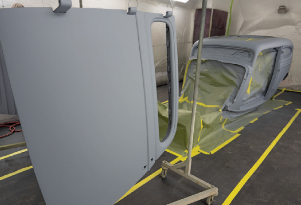 1930s Ford coupe body and door primed gray, masked for custom painting