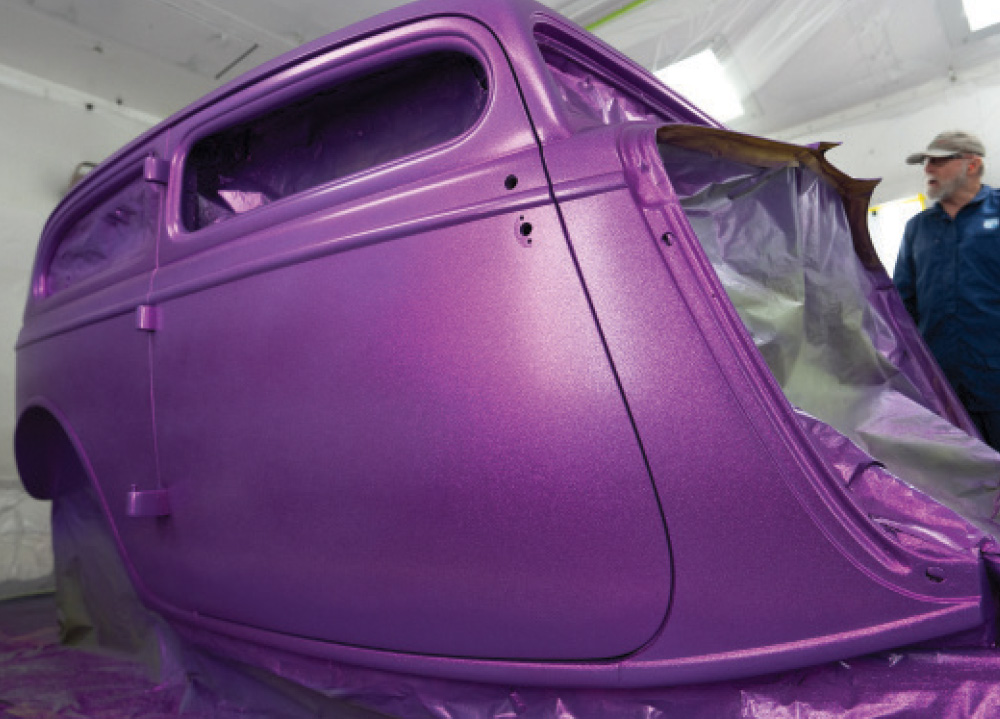 1934 Ford sedan hot rod masked and painted metallic purple flake in booth