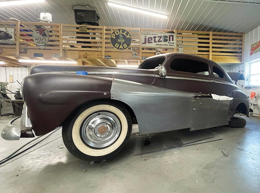 1947 Ford coupe, paper template on metalwork, fadeaway fender shaping in progress