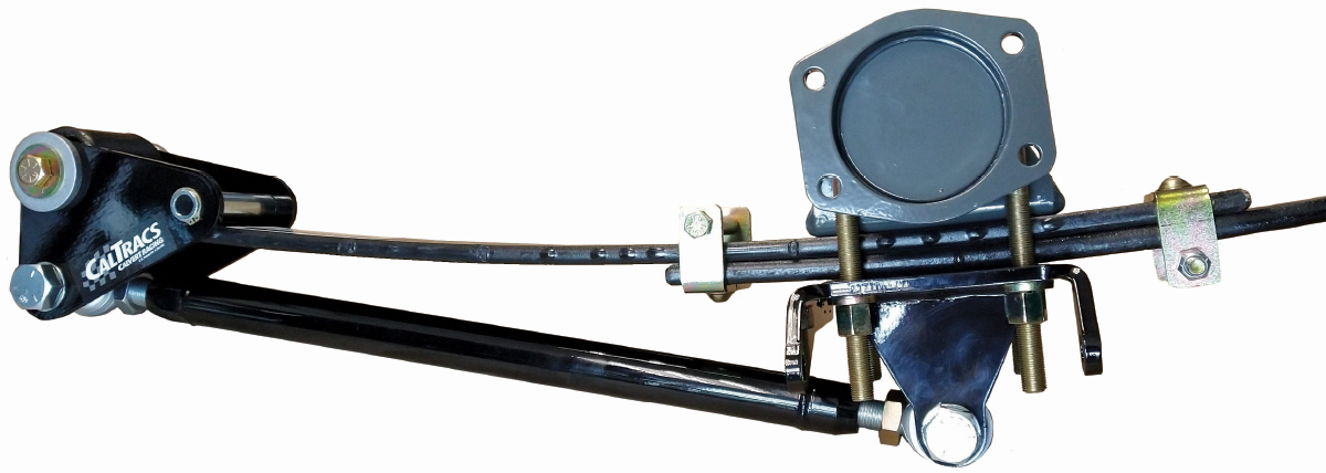 Isolated studio shot of a black CalTracs traction bar system assembly with a leaf spring and a gray axle mount on a white background.