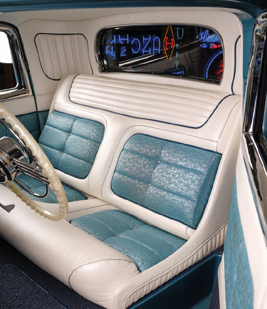 1932 Ford teal-and-white tuck-and-roll front seat upholstery with chrome trim accents