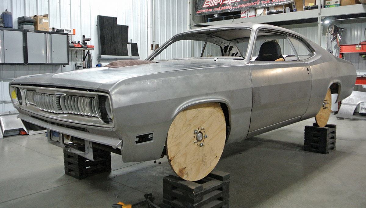 1971 Plymouth Duster bare metal body shell temporary wooden wheel mounts primer preparation BilletSpecialties banner