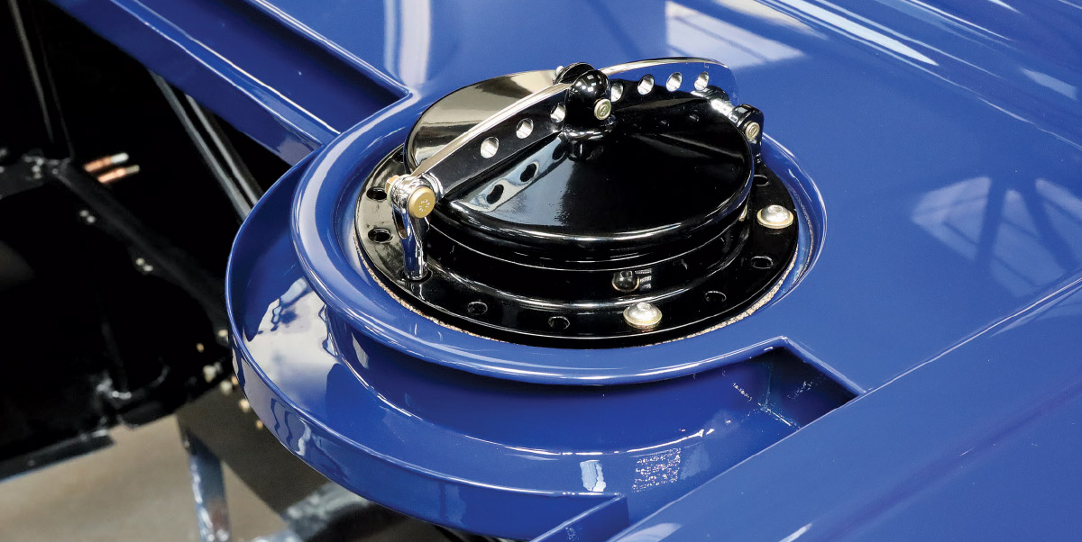 1932 Ford roadster custom fuel filler assembly mounted in blue bodywork with billet hardware