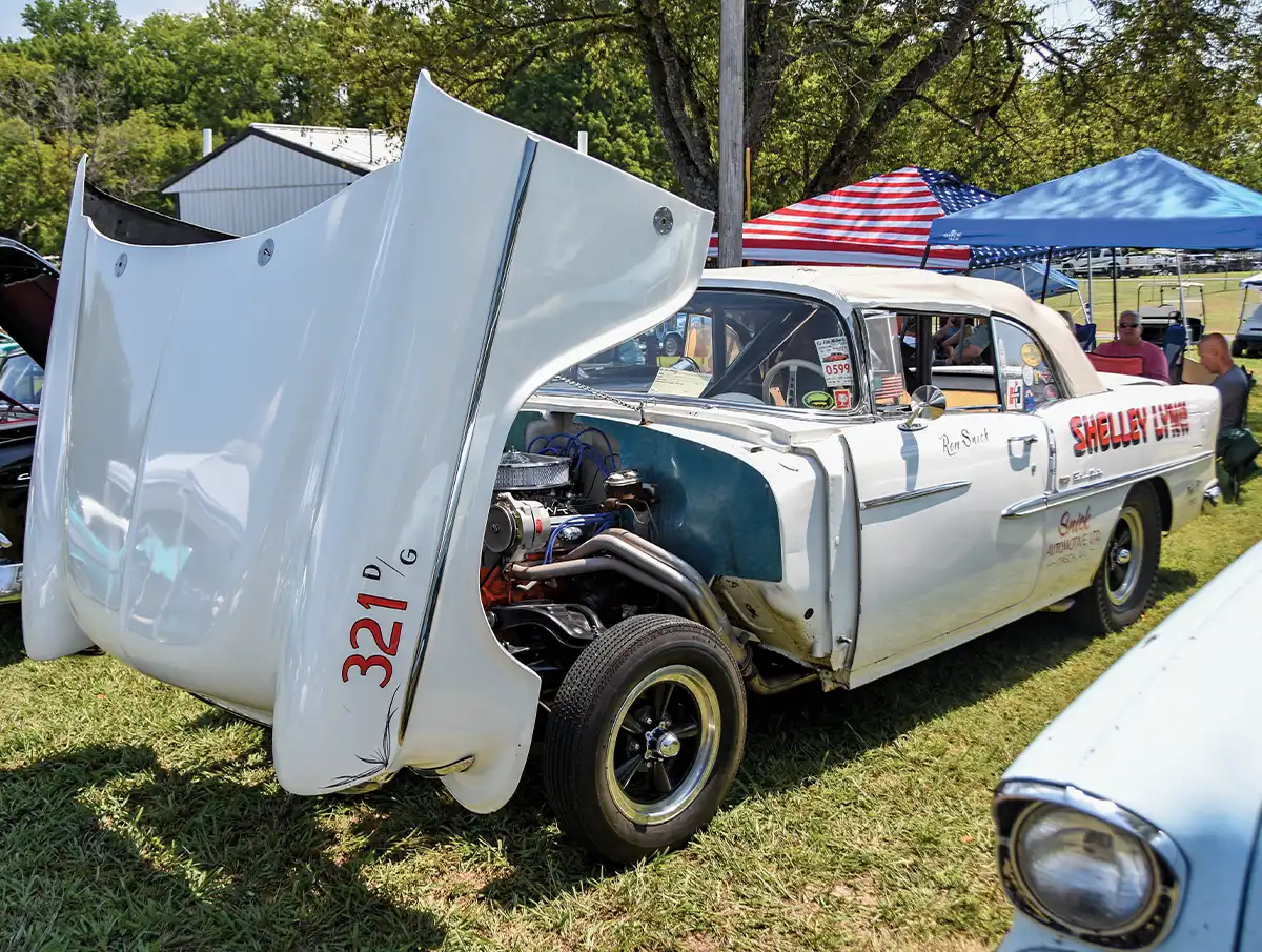 White Chevrolet gasser SHELLEY LYNN with raised front end, hood open, headers exposed