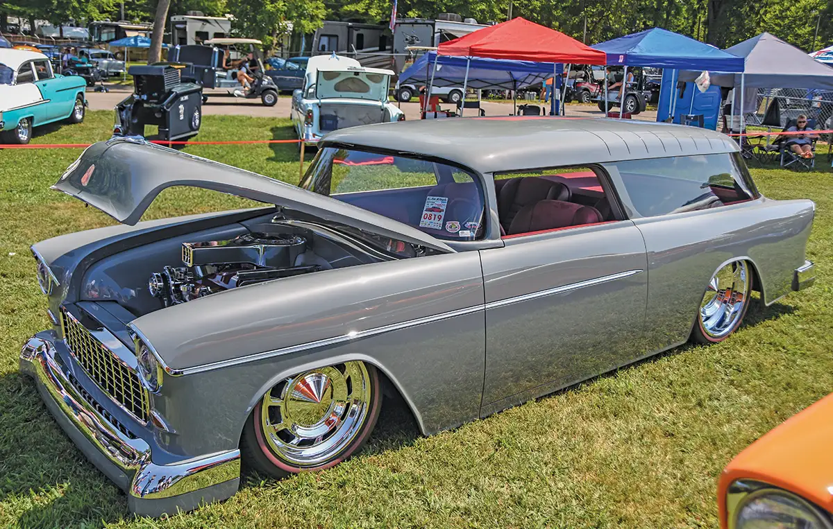 Gray 1955 Chevrolet Nomad wagon, low stance, chrome wheels, red interior