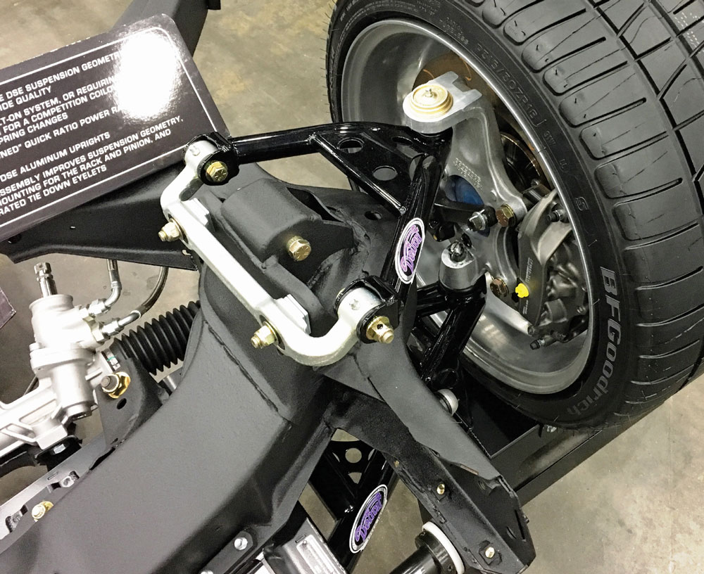 Close-up of the installed front suspension and brake assembly, featuring "Detroit Speed" branding and a BFGoodrich tire mounted on a modern silver alloy wheel.