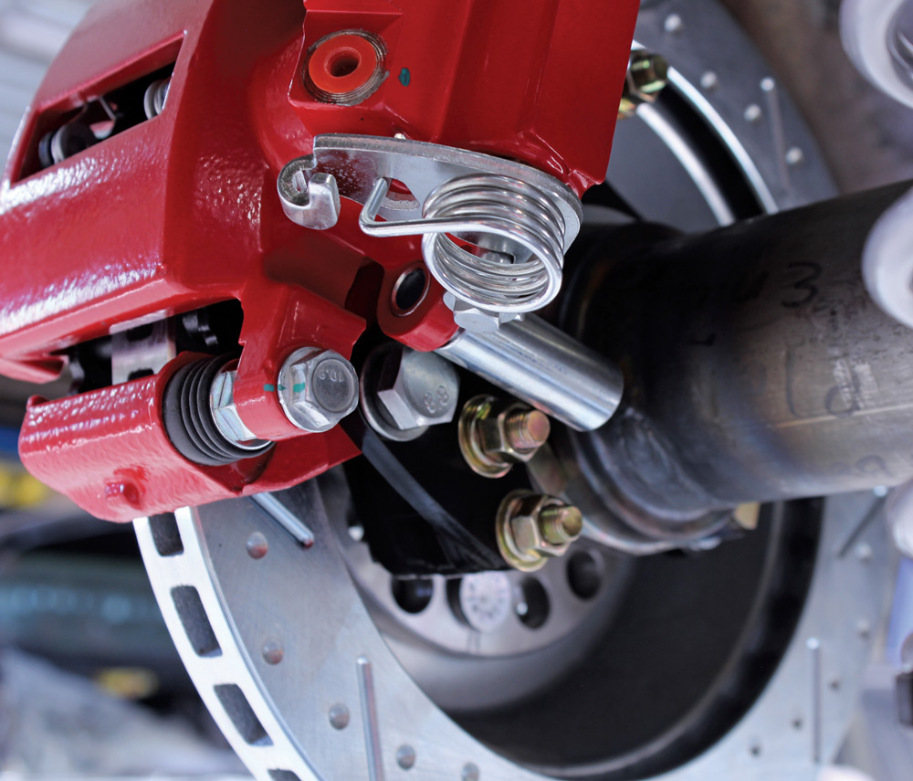 1965 mustang cpp rear disc brake completed install red caliper jegs coilover bracketed setup