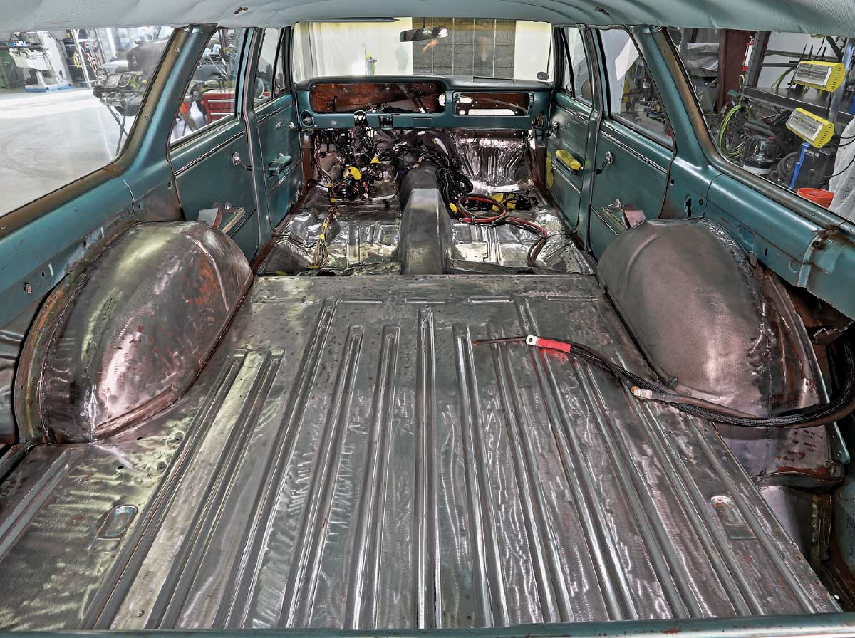 1965 chevelle wagon interior stripped rear section sound deadening wiring harness visible