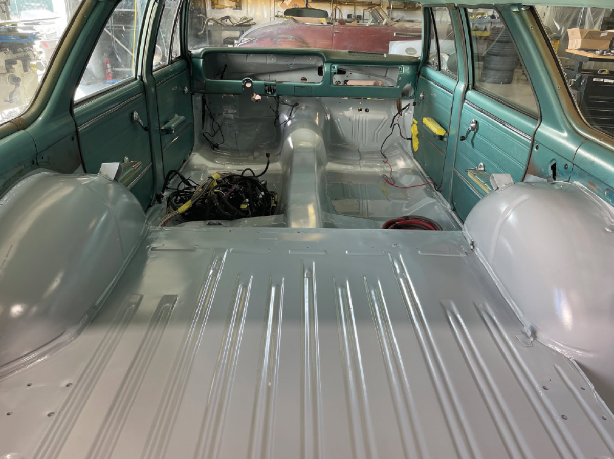 1965 chevelle wagon interior bare metal floor painted with wiring harness laid out for install