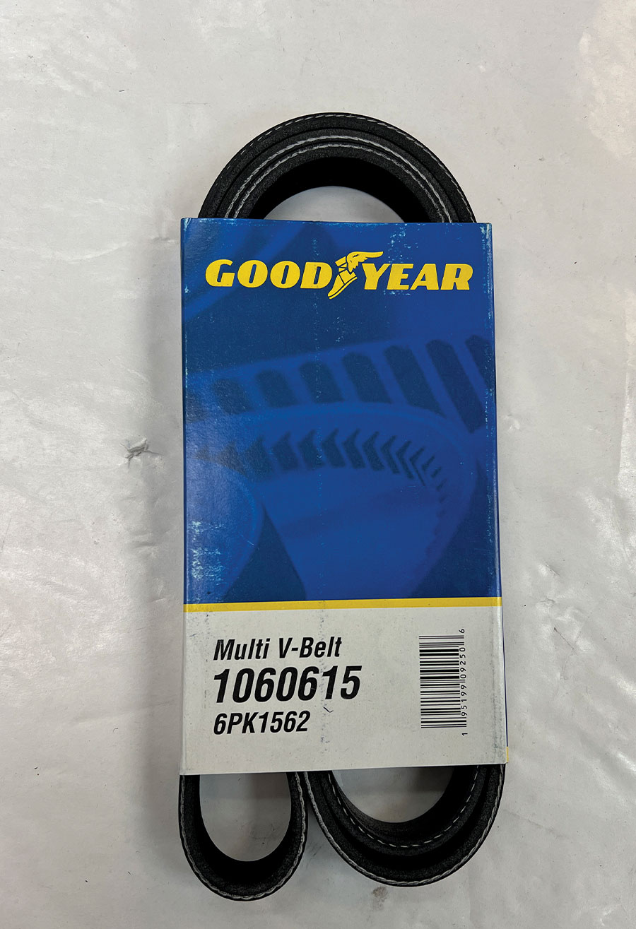 A high-performance Goodyear Multi V-Belt, part number 1060615 (6PK1562), shown in its original blue and yellow packaging, specifically used for serpentine engine accessory drive systems