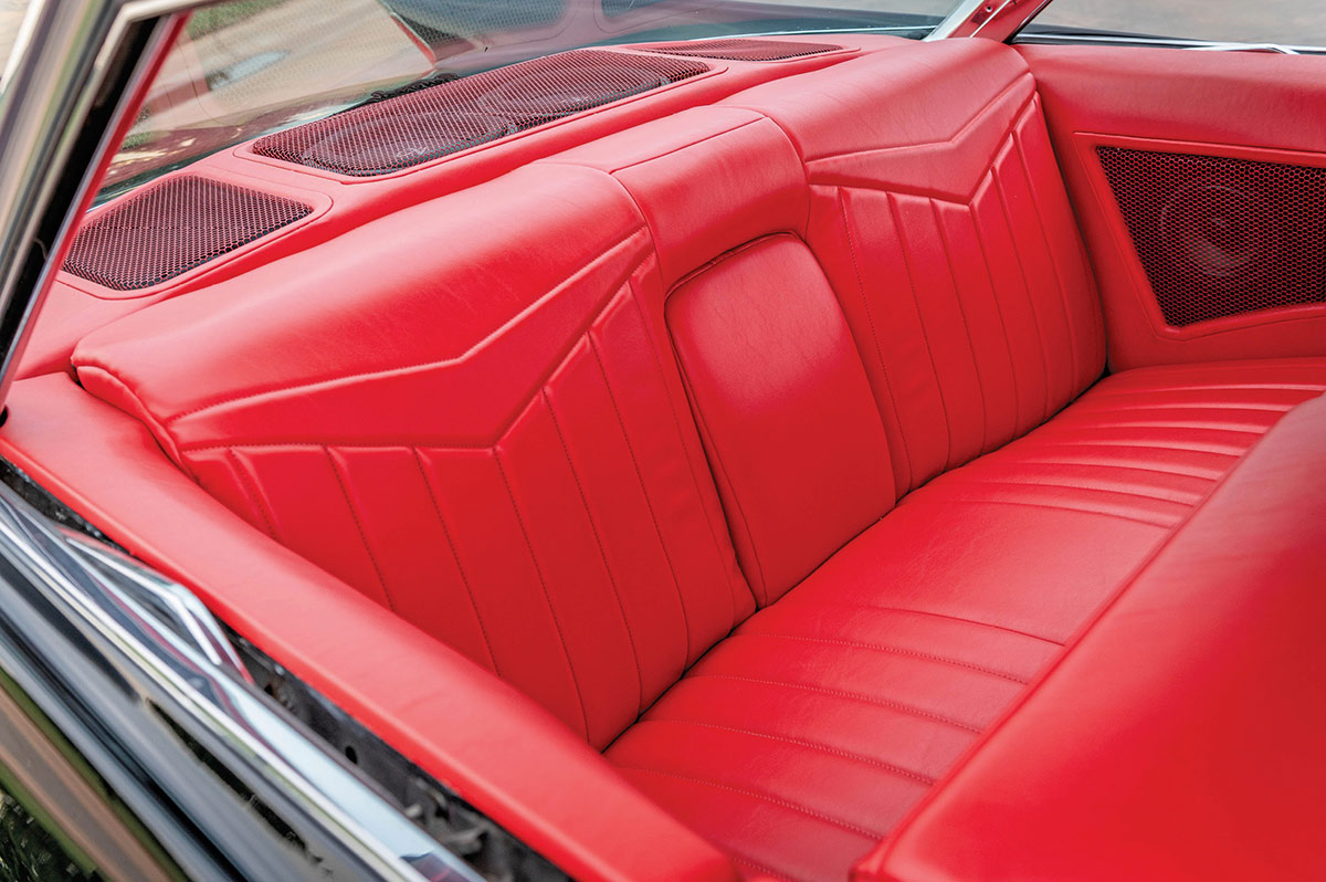 1961 Cadillac Coupe DeVille red rear bench seat classic interior upholstery vintage cabin detail