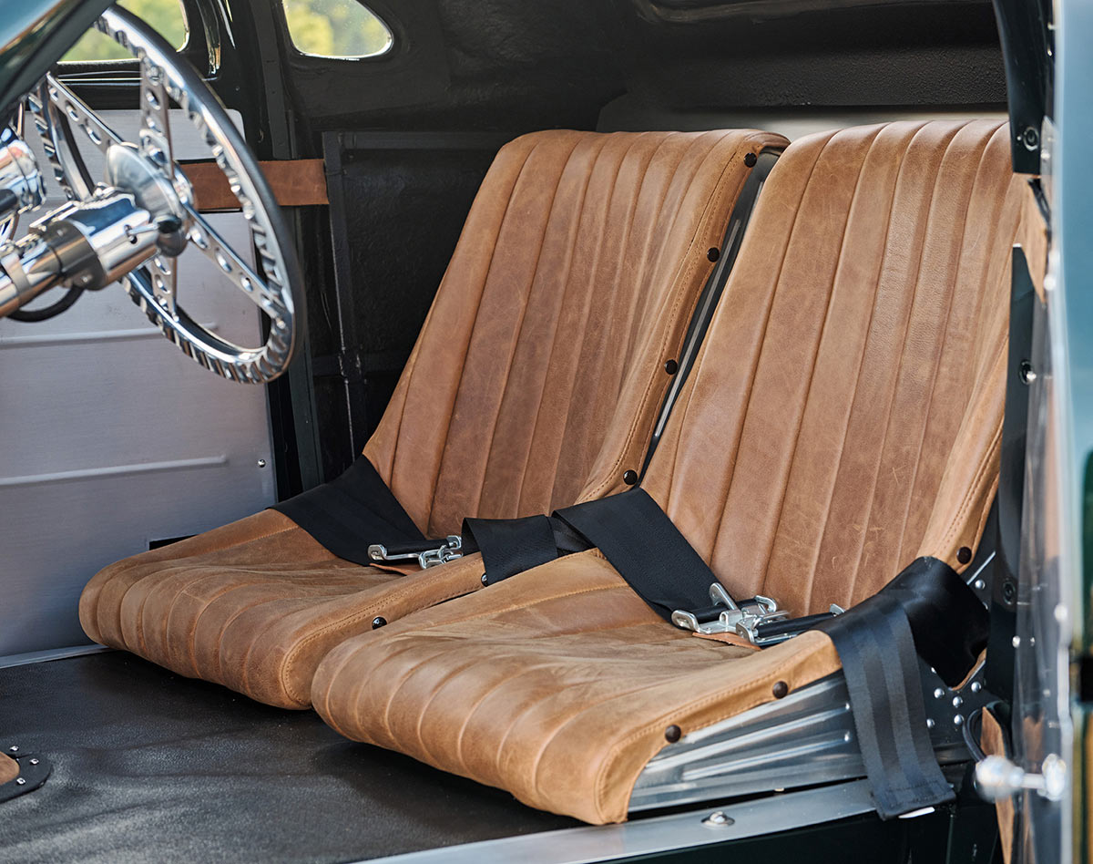 Distressed brown leather bucket seats in the interior