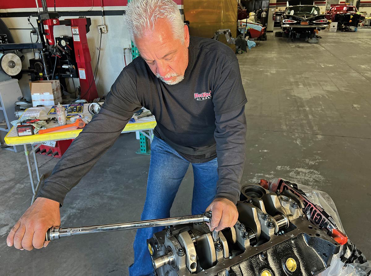 Technician tightening nuts on ARP main engine studs